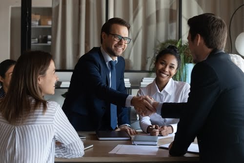 professional businesspeople reached agreement on negotiations