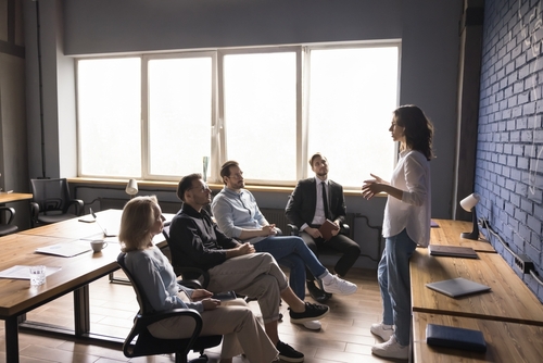 engaged young business coach girl giving training