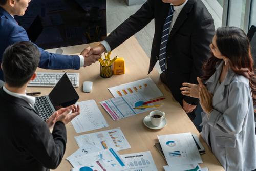 group business people handshake at meeting table in office